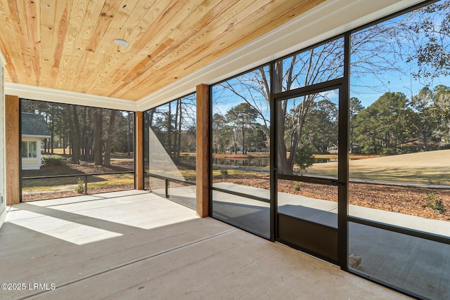 unfurnished sunroom with wood ceiling