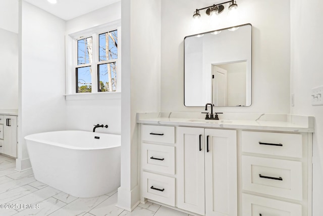 bathroom featuring vanity and a tub