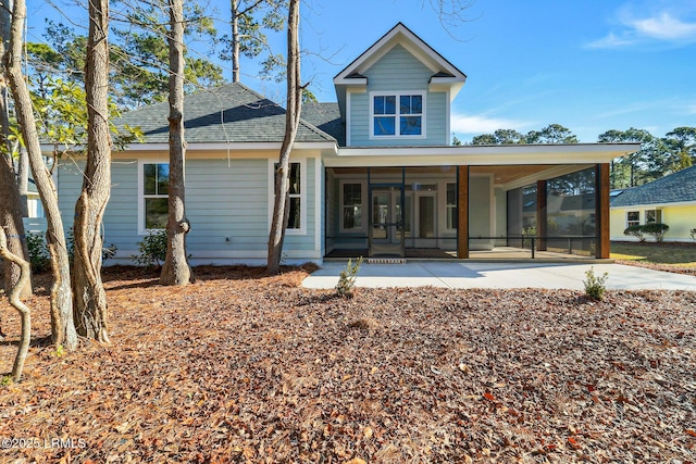 back of house with a sunroom