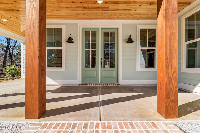 view of exterior entry featuring french doors