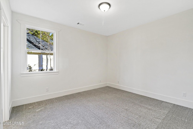 unfurnished room with carpet floors