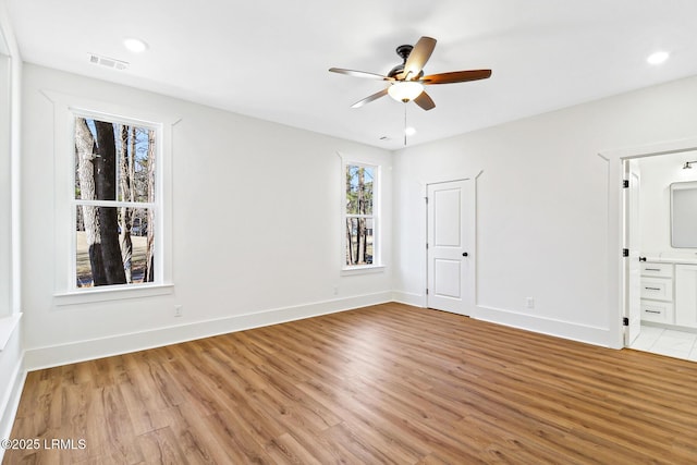 interior space with ceiling fan and light hardwood / wood-style floors