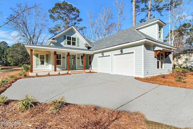 view of front of home featuring a garage and a porch