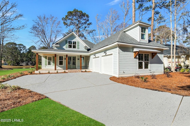 view of front of property featuring a porch and a garage