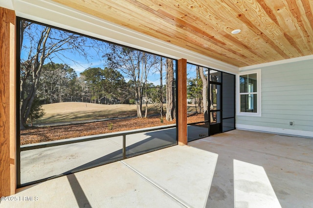 unfurnished sunroom featuring wooden ceiling