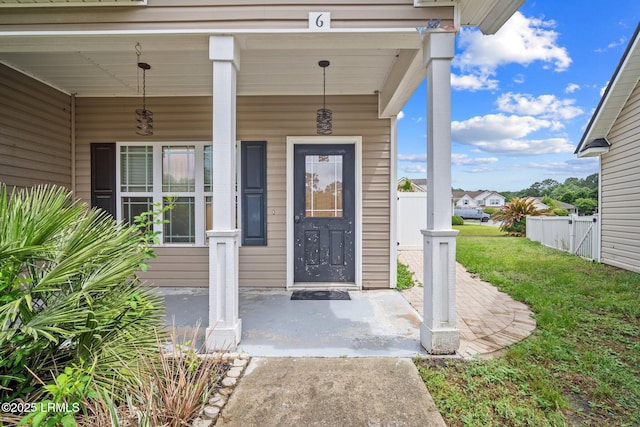 6 Broadland Cir, Bluffton, SC 29910 - doorway to property featuring covered porch and fence