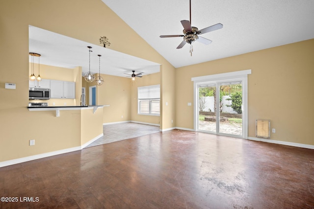 6 Broadland Cir, Bluffton, SC 29910 - unfurnished living room with a ceiling fan, baseboards, and high vaulted ceiling