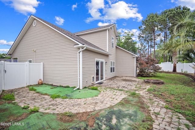 6 Broadland Cir, Bluffton, SC 29910 - rear view of property with a patio, a fenced backyard, a fire pit, and a shingled roof