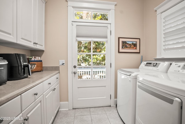 120 Coosaw Club Dr, Beaufort, SC 29907 - clothes washing area featuring independent washer and dryer, cabinet space, light tile patterned floors, and baseboards
