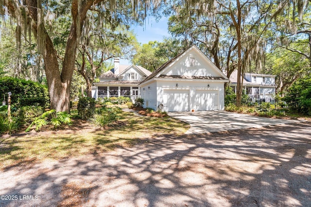 120 Coosaw Club Dr, Beaufort, SC 29907 - view of front of house with a chimney and a detached garage
