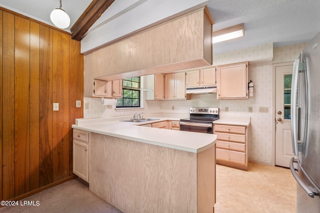 kitchen with appliances with stainless steel finishes, light brown cabinetry, kitchen peninsula, and vaulted ceiling with beams