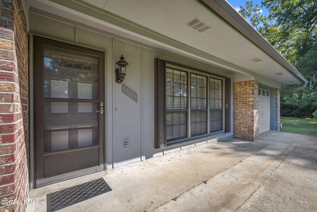 property entrance with a garage