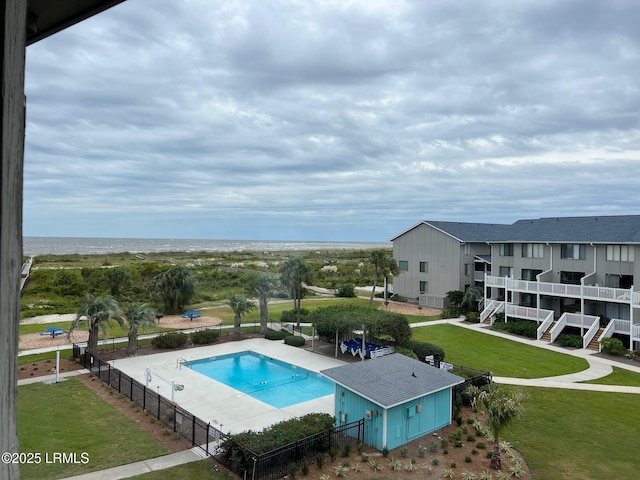 view of pool featuring a yard