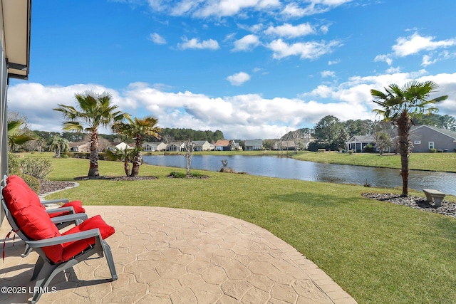 view of patio featuring a water view and a residential view