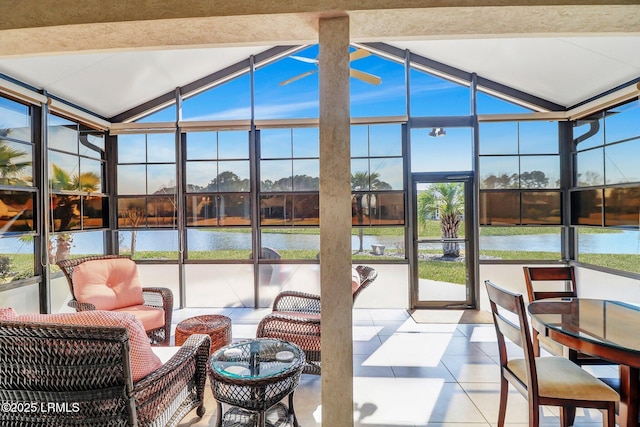 sunroom with a water view and vaulted ceiling