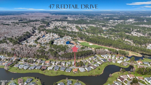 birds eye view of property featuring a residential view and a water view