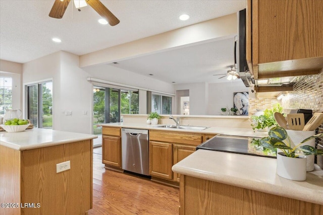 6 Pinyon Dr, Bluffton, SC 29909 - kitchen with dishwasher, a sink, ceiling fan, tasteful backsplash, and light wood-type flooring