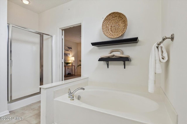 6 Pinyon Dr, Bluffton, SC 29909 - bathroom with a stall shower, a garden tub, a textured ceiling, and tile patterned floors