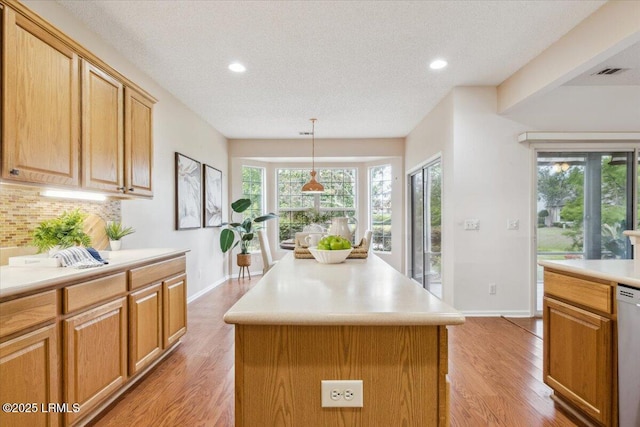 6 Pinyon Dr, Bluffton, SC 29909 - kitchen featuring backsplash, light countertops, baseboards, light wood finished floors, and recessed lighting