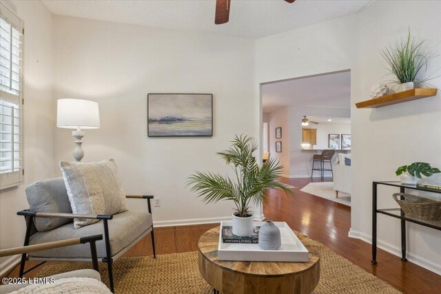 6 Pinyon Dr, Bluffton, SC 29909 - living area featuring ceiling fan, wood finished floors, and baseboards