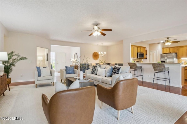 6 Pinyon Dr, Bluffton, SC 29909 - living room with a ceiling fan, wood finished floors, a chandelier, and baseboards