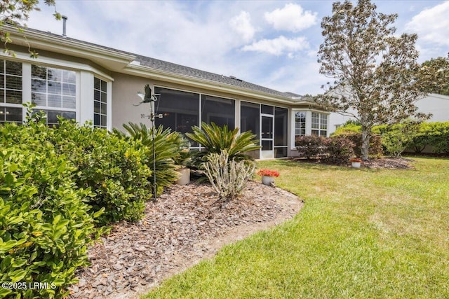 6 Pinyon Dr, Bluffton, SC 29909 - rear view of house featuring a yard, a sunroom, and stucco siding