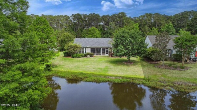 6 Pinyon Dr, Bluffton, SC 29909 - view from above of property with a large body of water and a heavily wooded area