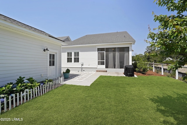 11 Basin Trail St, Beaufort, SC 29902 - back of house with a patio, a sunroom, and roof with shingles