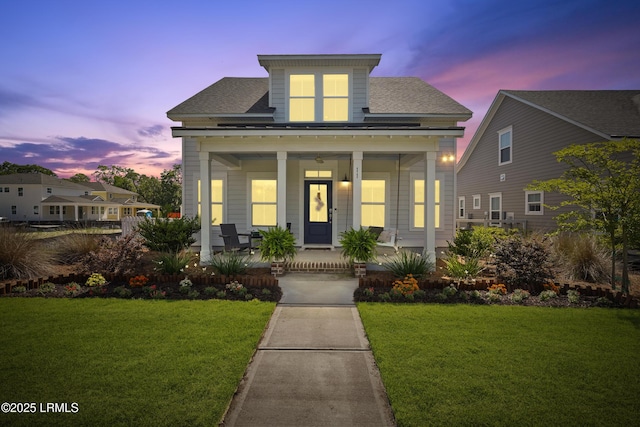 11 Basin Trail St, Beaufort, SC 29902 - view of front facade featuring a porch, a yard, and roof with shingles