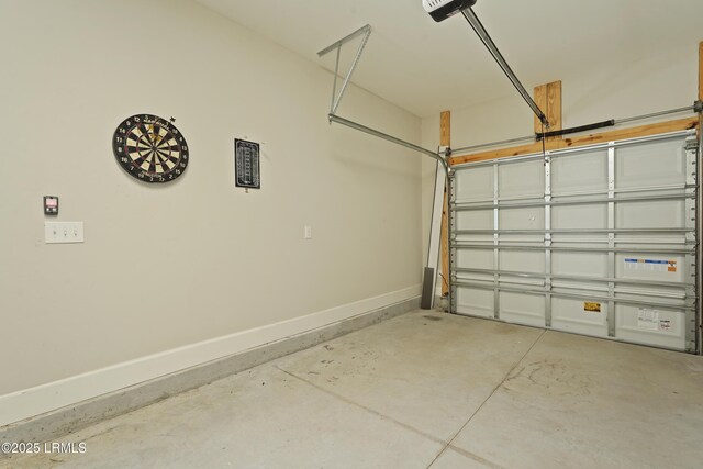 11 Basin Trail St, Beaufort, SC 29902 - garage featuring baseboards and a garage door opener