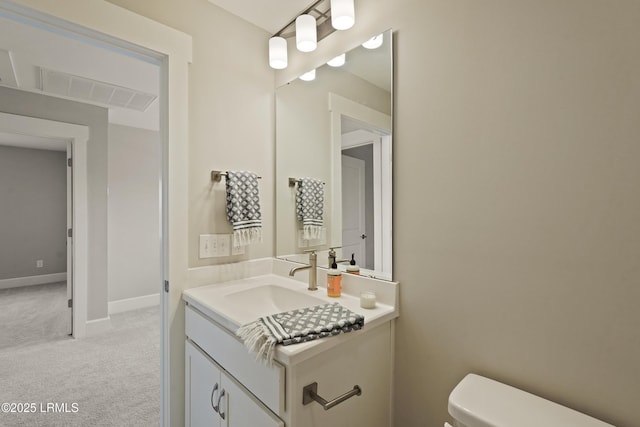 11 Basin Trail St, Beaufort, SC 29902 - half bathroom featuring vanity, toilet, and baseboards