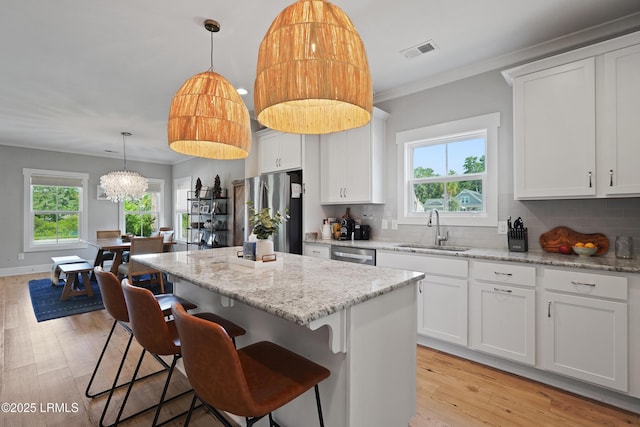 11 Basin Trail St, Beaufort, SC 29902 - kitchen featuring a sink, stainless steel appliances, plenty of natural light, backsplash, and crown molding
