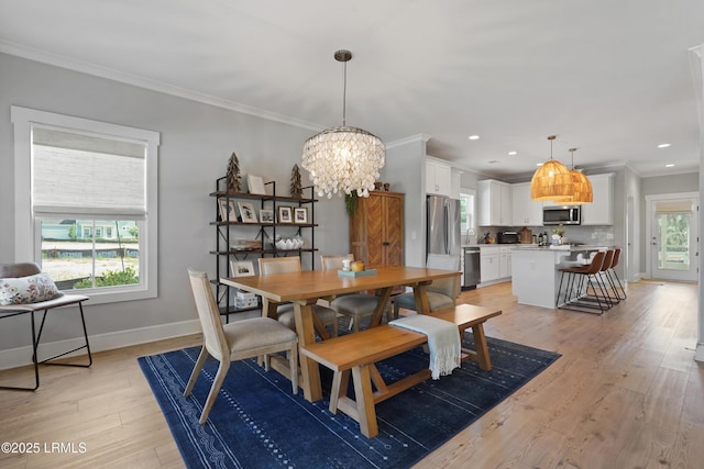 11 Basin Trail St, Beaufort, SC 29902 - dining room featuring light wood finished floors, a chandelier, crown molding, baseboards, and recessed lighting