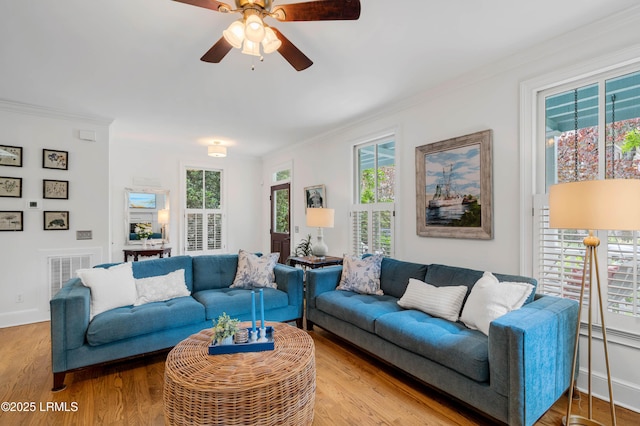 14 Fraser St, Beaufort, SC 29907 - living area featuring ornamental molding, wood finished floors, ceiling fan, and baseboards