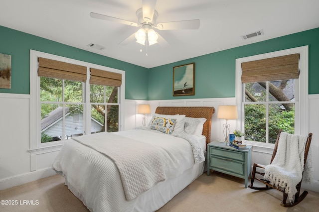 14 Fraser St, Beaufort, SC 29907 - bedroom with carpet flooring, a wainscoted wall, and a ceiling fan