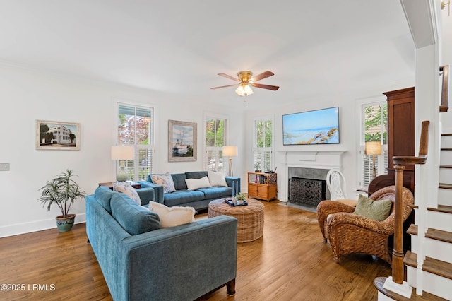 14 Fraser St, Beaufort, SC 29907 - living room featuring healthy amount of natural light, ceiling fan, stairway, and a fireplace
