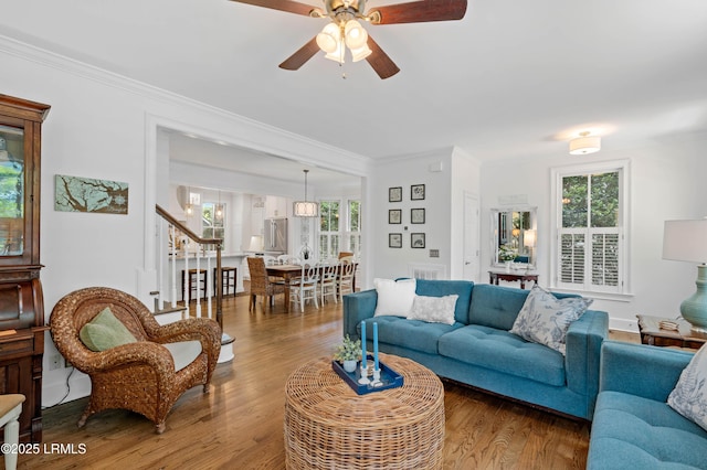 14 Fraser St, Beaufort, SC 29907 - living area featuring plenty of natural light, ornamental molding, stairs, a ceiling fan, and wood finished floors