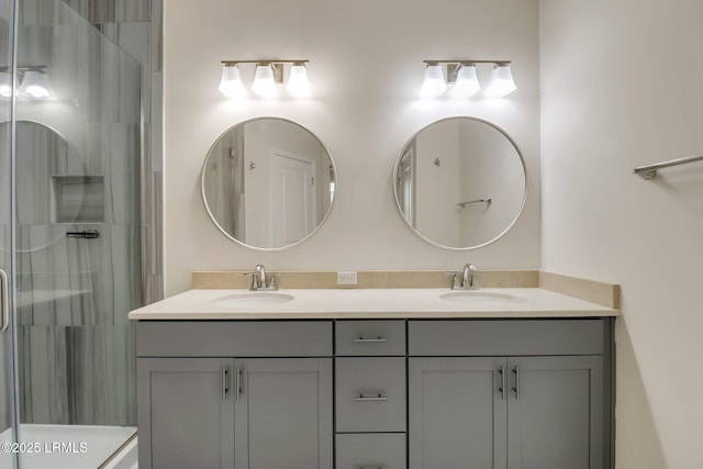 bathroom with a shower with door and vanity