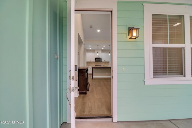 entrance to property with a sink