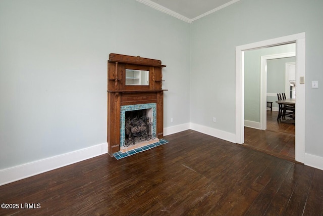 unfurnished living room featuring crown molding, a high end fireplace, and dark wood-type flooring