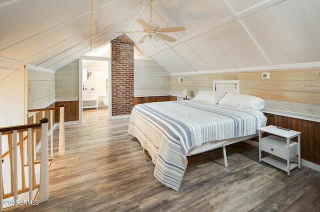 bedroom featuring wood-type flooring, ceiling fan, and wood walls