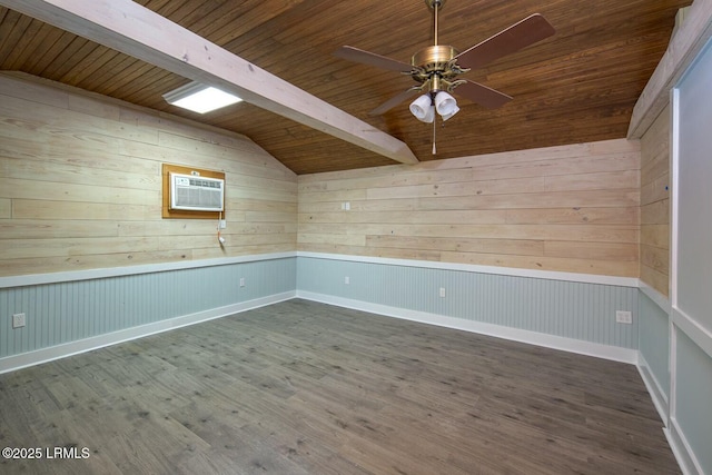 spare room with wood ceiling, hardwood / wood-style flooring, ceiling fan, lofted ceiling with beams, and an AC wall unit