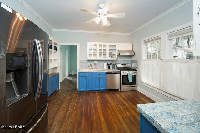 kitchen with blue cabinetry, appliances with stainless steel finishes, white cabinetry, dark hardwood / wood-style floors, and tasteful backsplash