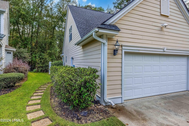 view of property exterior with a garage