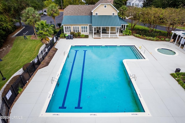 view of swimming pool featuring a patio