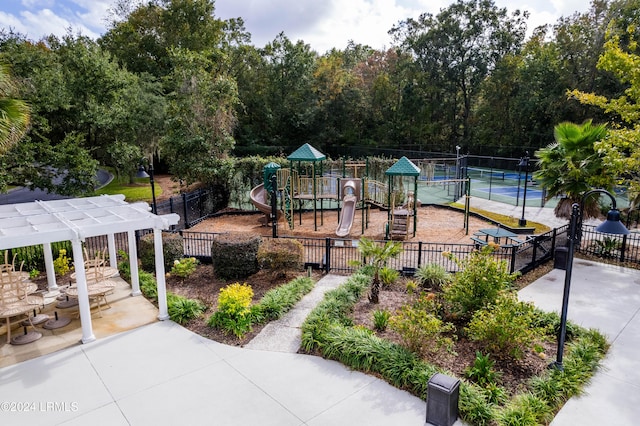 view of playground featuring tennis court