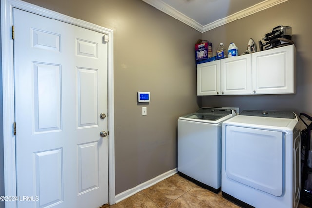 laundry room with light tile patterned flooring, cabinets, ornamental molding, and washer and dryer