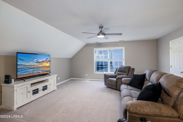 living room featuring ceiling fan, light colored carpet, and vaulted ceiling