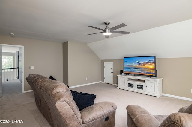 living room featuring ceiling fan, lofted ceiling, and light carpet