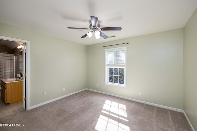 unfurnished bedroom with ceiling fan and light carpet